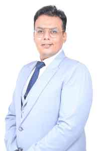 Male doctor in white coat representing men's health specialist at Sidri International.